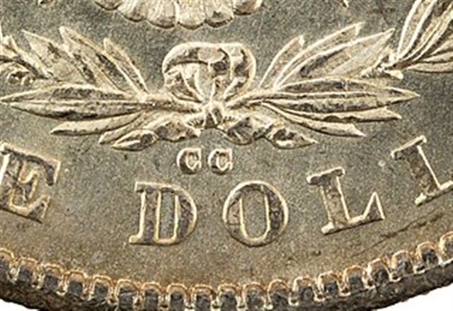 Close-up of the CC mint mark below the wreath bow